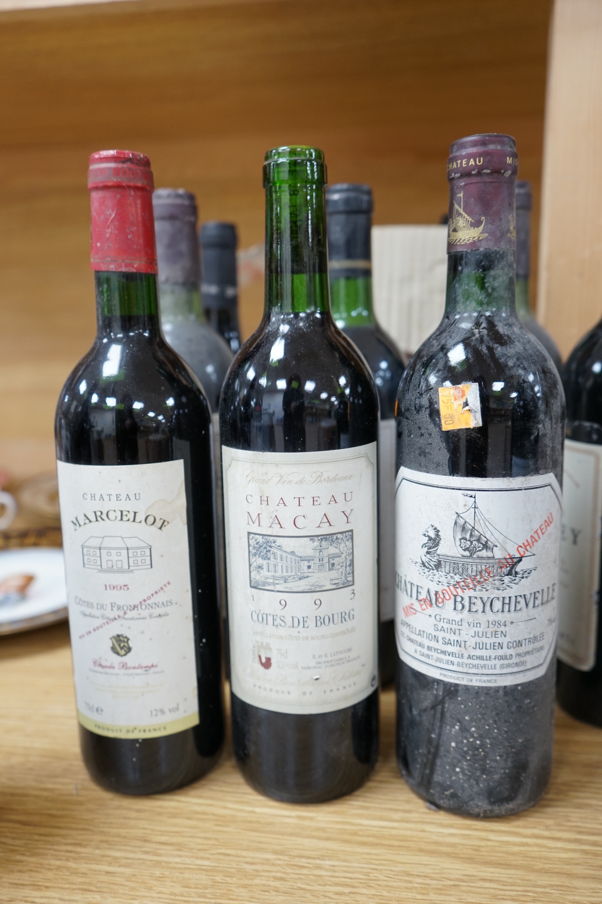 Sixteen bottles of mixed red wine, including claret; two Gaffeliere Saint Emilion 1982, Chateau Corbin 1990 etc. and six bottles of Ciro rosso classico supreme. Condition - fair, storage history unknown